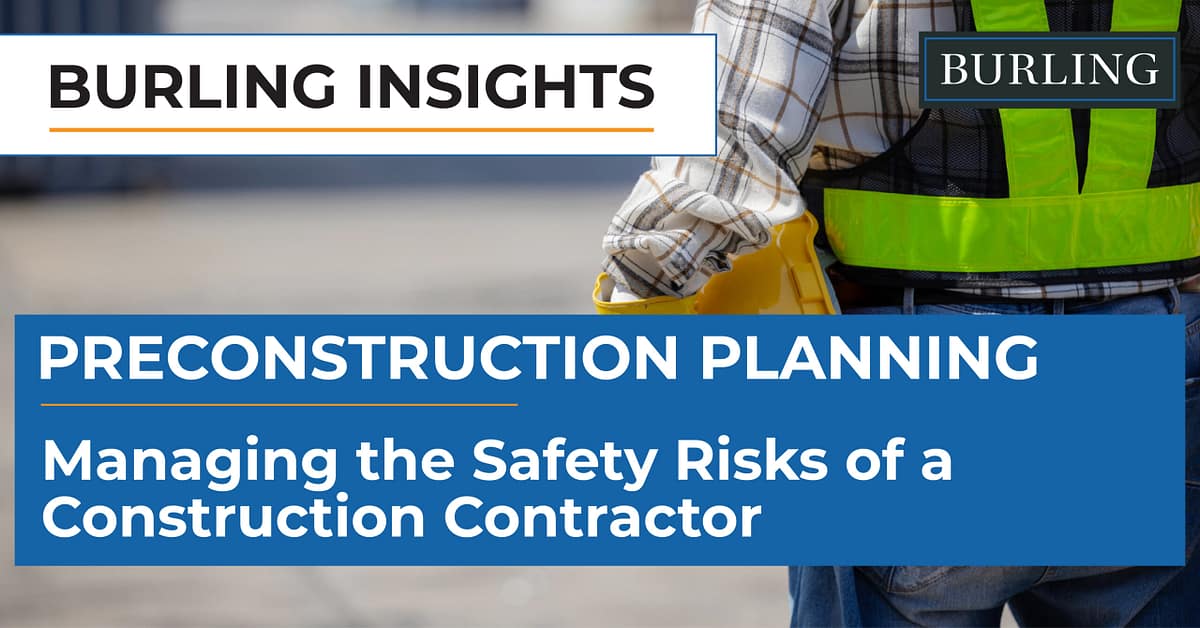 Construction superintendent reviewing safety compliance with subcontractors on a commercial jobsite.